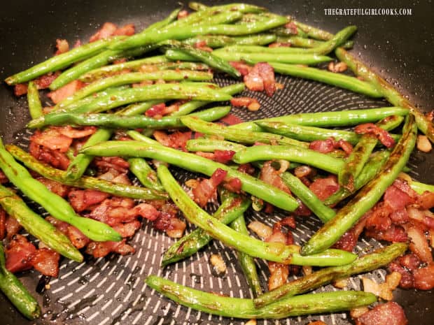 After heating them though, pan-seared green beans and bacon are ready to serve.