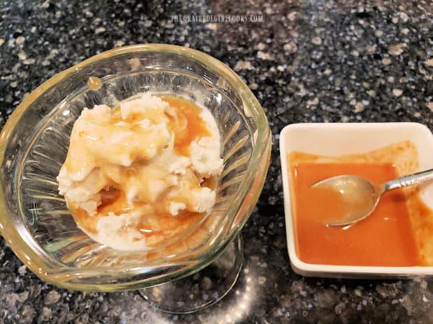 Peanut butter ice cream sauce over a scoop of vanilla ice cream.