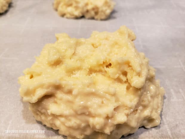 A mound of shortcake batter on parchment paper, ready to be baked.