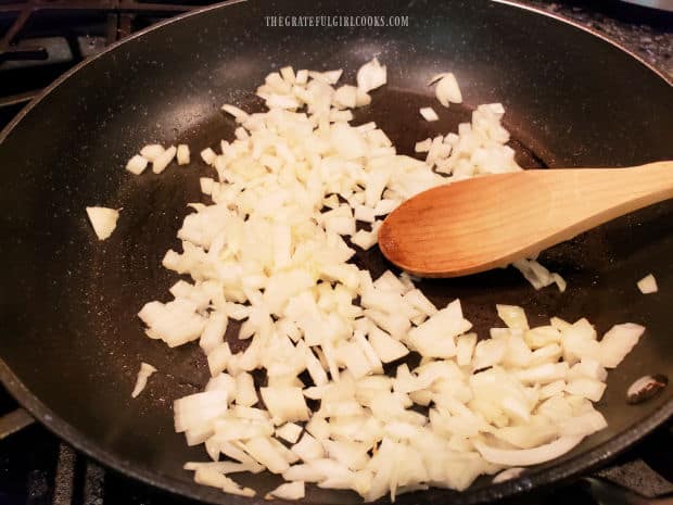 Chopped onions are cooked until tender in large skillet.