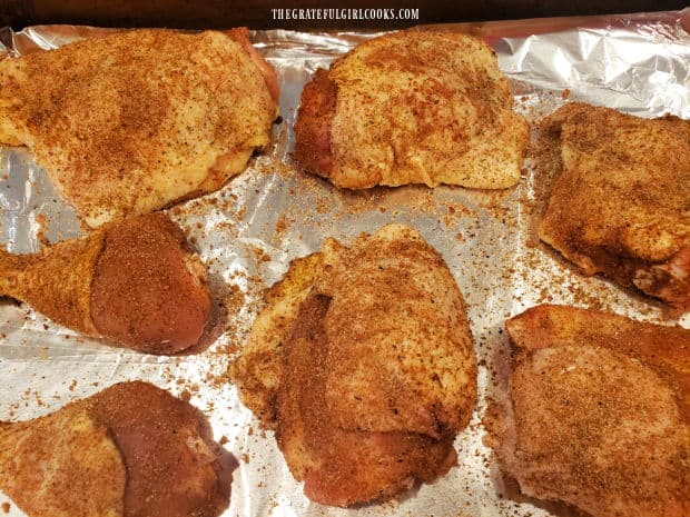 Seasoning mix is applied to both sides of the chicken pieces.