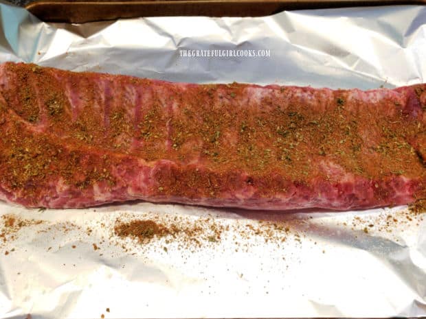 Light coating of seasoning covers the bone side of the rack of ribs.