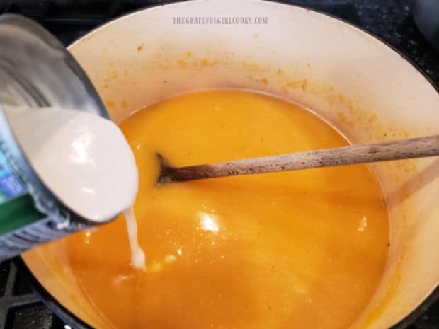 Canned coconut milk is stirred into the creamy pumpkin coconut soup.