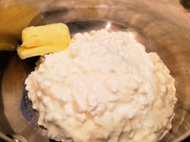 Cottage cheese and butter are warmed slightly in a small saucepan.