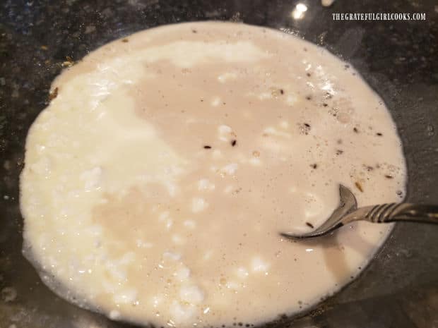 Yeast and water, plus butter and cottage cheese are added to mixing bowl.