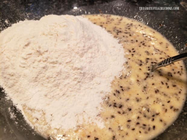 All purpose flour is added to the dilly bread dough in bowl.