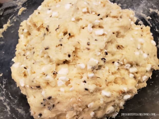 The dough has risen, then it is punched down in the bowl, to deflate.