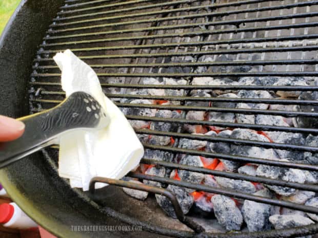 The BBQ grill grates are lightly oiled before putting the halibut on the hot grill.
