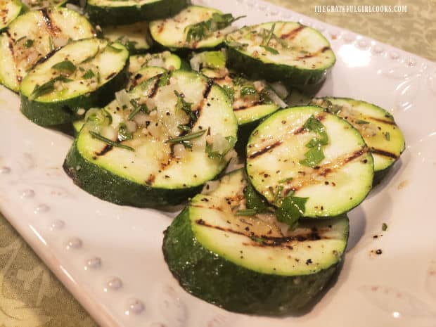 Herb garlic dressing tops the hot, grilled herb garlic zucchini when served.