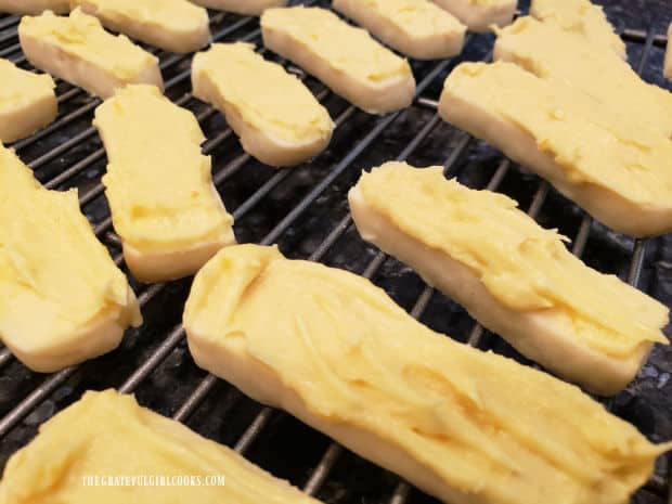 Lemon frosting is spread on the lemon meltaway cookies before serving.