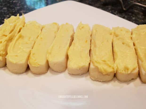 A white plate with several lemon meltaway cookies, ready for eating.