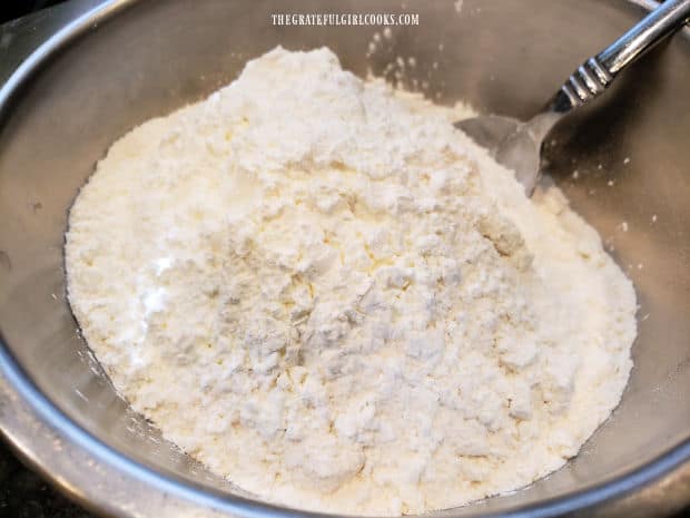 Lemon juice, flour and cornstarch are added to the butter mixture in bowl.