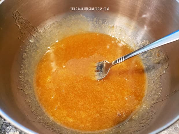 Mixed with a fork, the pie filling is combined and ready to fill pie crusts.