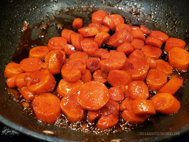 Carrots are tender, and liquid has reduced to a fine gloss when done.