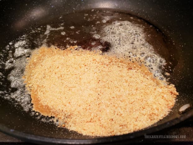 Breadcrumbs are added to melted butter in skillet and toasted for 3 minutes.