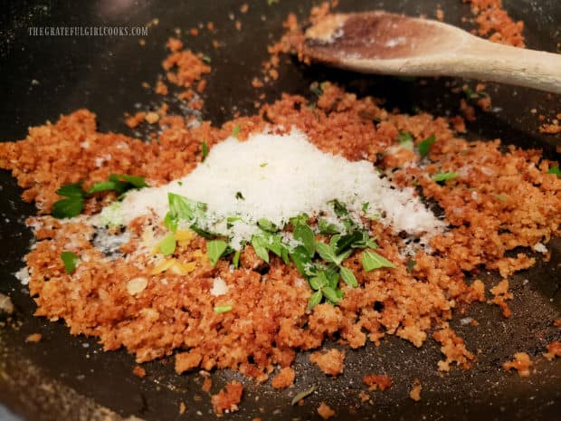 Parmesan cheese, herbs, salt and lemon zest are added to toasted breadcrumbs.