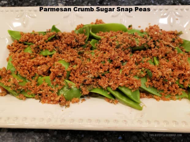 Parmesan Crumb Sugar Snap Peas is an easy veggie dish, with sugar snap peas topped with buttery toasted Parmesan, lemon and herb breadcrumbs.