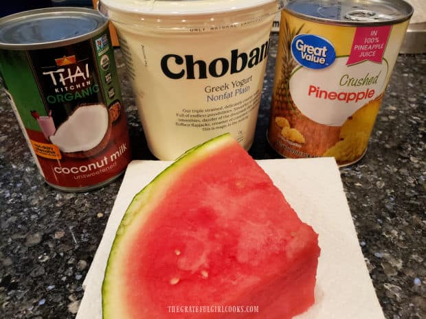 Canned coconut milk, watermelon, plain yogurt and pineapple used for smoothie.