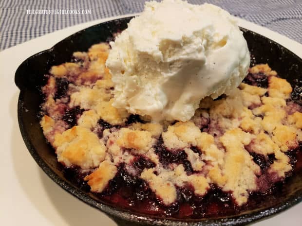 One of the blackberry cobbler mini skillets, served with ice cream on top.