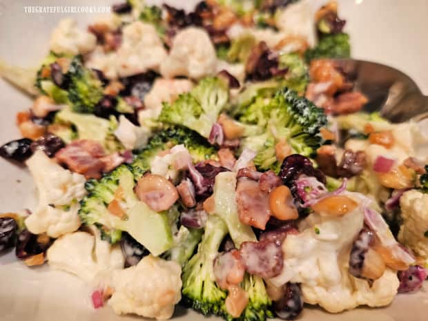 A close up picture of the cauliflower broccoli bacon salad.