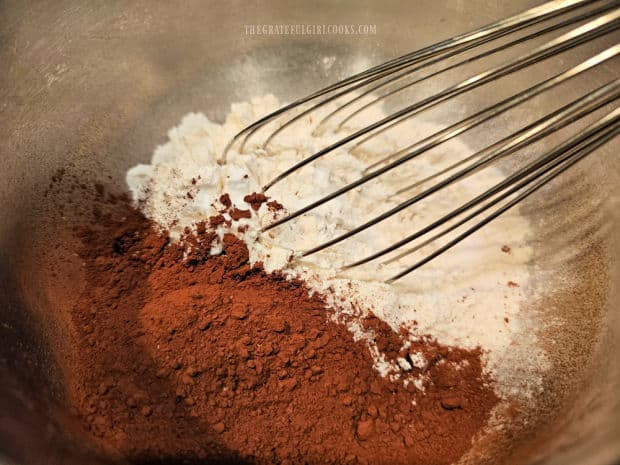 Flour, cocoa powder, baking soda, salt, baking powder are whisked together.