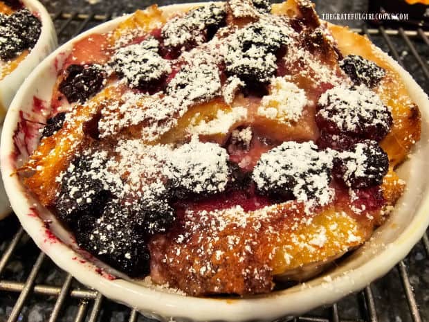 Powdered sugar is sifted on Blackberry French Toast Cups for serving.