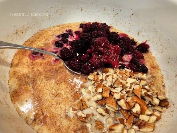 Chopped pecans are blackberries are gently stirred into batter, until combined.
