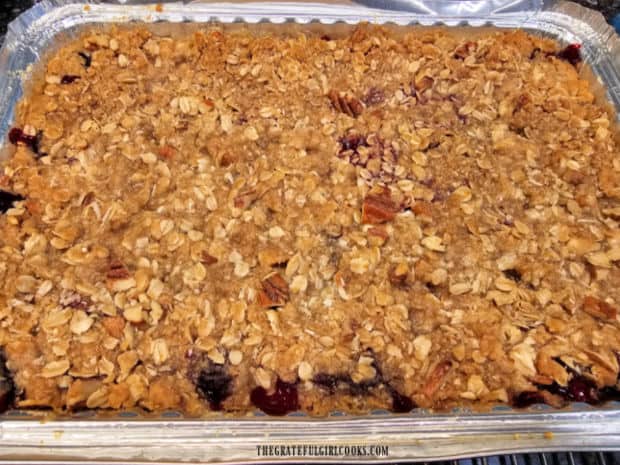 The blackberry pecan crisp cools on a wire rack after being baked.