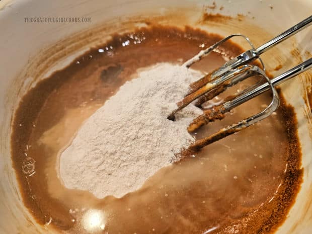 Hot water is added to dry ingredients and gingerbread batter.