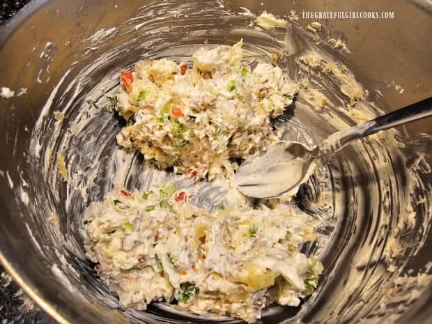 Cream cheese mixture is divided in half, to form two cheese balls.