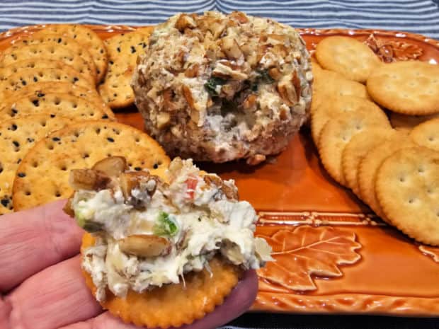 Some of the pecan pineapple cheese ball, shown once spread on a cracker.