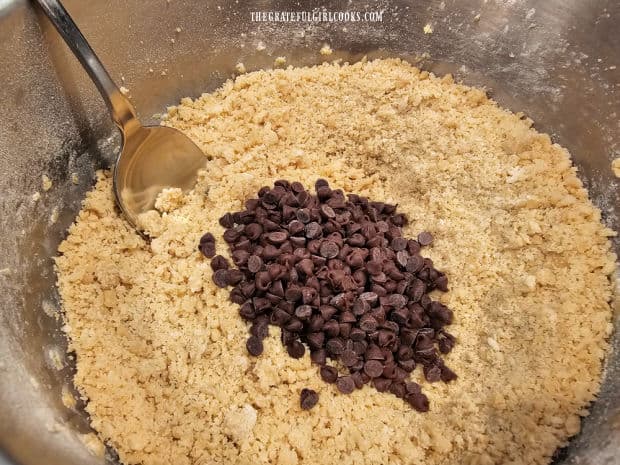 Miniature semi-sweet chocolate chips are stirred into the dough.