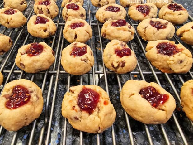 The raspberry thumbprint cookies cool on wire rack after baking.