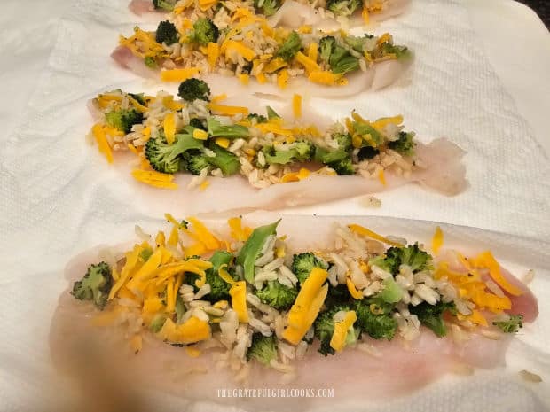 Broccoli, cheese and rice mixture is used to top the Dove sole filets.