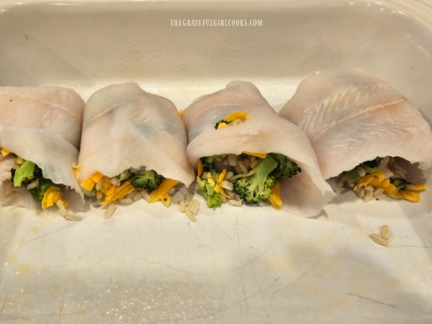 Fish fillets are rolled around the stuffing and placed in greased baking dish.