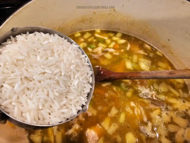 Uncooked long grain white rice is added to the turkey mulligatawny soup.