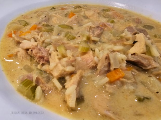 Lots of veggies and meat in a bowl of turkey mulligatawny soup.