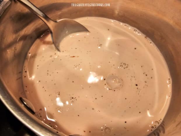 The creamer liquid is heated through in a saucepan.