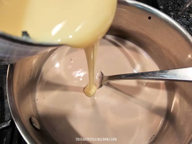 Sweetened condensed milk is added to other creamer ingredients in pan.