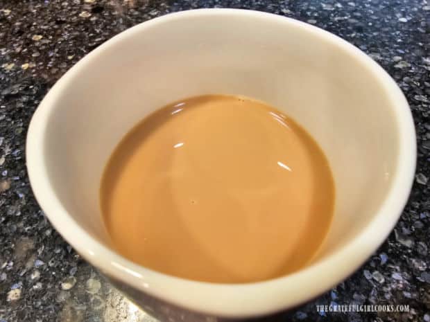 A mug of coffee with coconut almond coffee creamer, ready to enjoy.