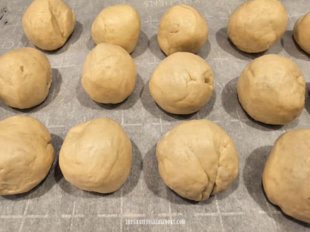 Each biscuit dough half is shaped into a ball.