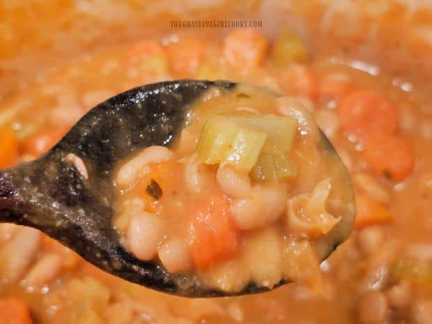 A spoonful of the thick, creamy Greek Cannellini Bean Stew.