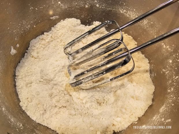 Electric mixer is used to combine peppermint filling ingredients in a bowl.