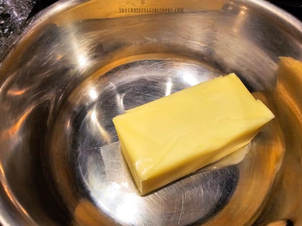 Butter is melted in a saucepan as a base for the seasoning sauce.