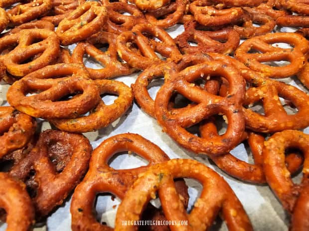 Close up photo of the ranch pretzel bites, cooling on parchment paper.