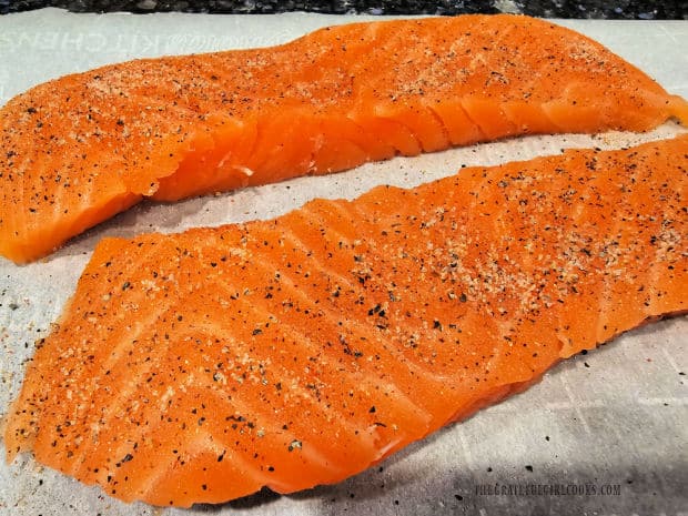 Boneless, skinless salmon fillets are patted dry, then seasoned lightly.