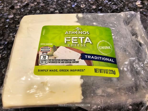 Half a block of feta cheese is used to top the traditional Greek salad.