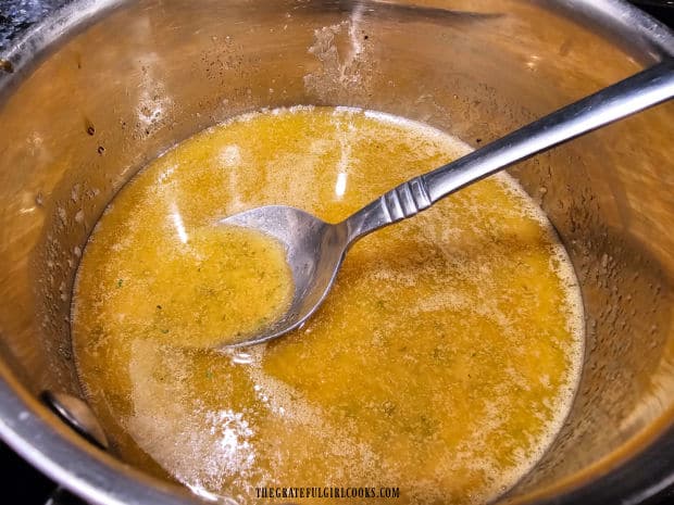 The buttery seasoning sauce is ready to be baked on twist pretzels.