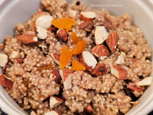 Apricot Almond Breakfast Quinoa in a white bowl, ready to eat.