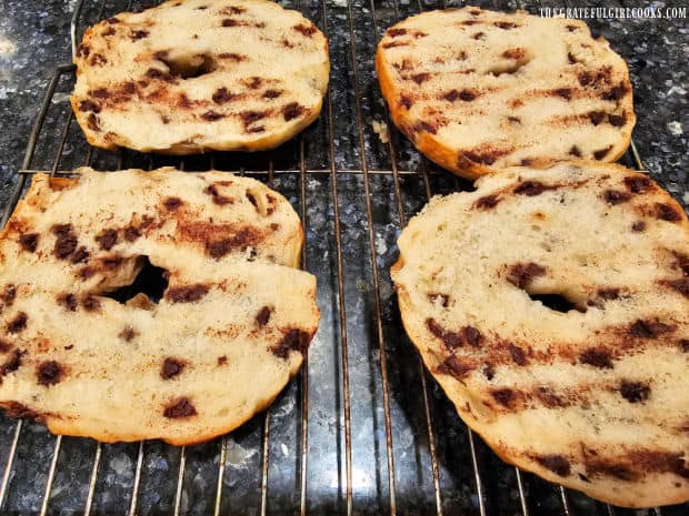 Cutting the bagels in half shows all the chocolate chips inside.